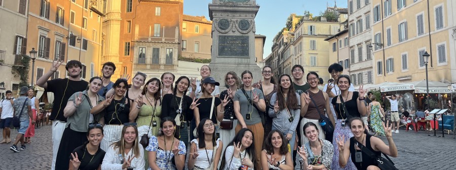 2 of 2, Group photo of Revelle in Rome students posing in a town square.